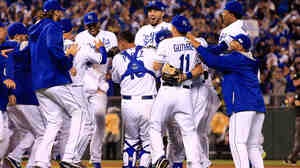 The Kansas City Royals celebrate after defeating the Los Angeles Angels 8-3 to sweep the series in Game 3 of the American League Division Series at in Kansas City, Mo., on Sunday