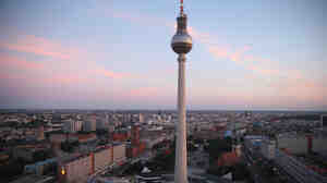 The broadcast tower at Alexanderplatz looms over the city center. A crossing point of tourists, commuters, shoppers, lovers, artists and bums, Alexanderplatz was rebuilt by the communist authorities of former East Germany in the 1960s. Today, it's a popular gathering place in the reunified city.