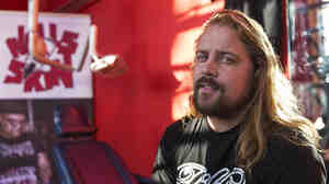 Tattoo artist Peter van der Helm, shown in his studio in Amsterdam in December 2013, has set up a business to preserve the tattoos of the dead.