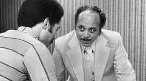 Comer Cottrell, right, confers with adman Jerry Metcalf in 1977.