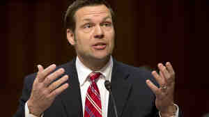 Kansas Secretary of State Kris Kobach testifies before the Senate Judiciary Committee hearing on immigration reform in Washington, D.C., in April. Kobach's challenger, Democrat Jean Schodorf, promises to stay closer to Kansas.