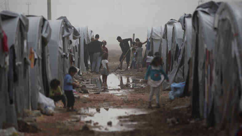 Syrian Kurdish refugees who fled Kobani make do in a refugee camp in Suruc, on the Turkey-Syria border on Saturday. The Syrian Kurdish border town of Kobani and its surrounding areas have been under assault by the so-called Islamic State since mid-September.
