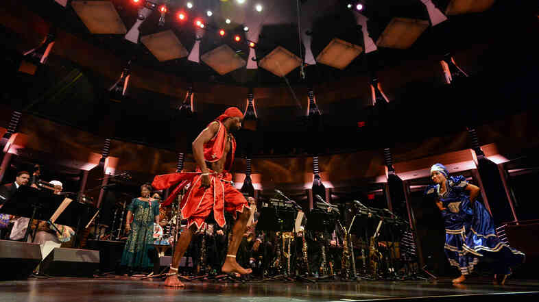 Dreiser Durruthy Bambolé (left) and Yesenia Fernandez Selier dance in front of the Jazz at Lincoln Center Orchestra.