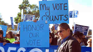 Navajo presidential candidate Chris Deschene greets supporters ahead of a hearing in Window Rock, Ariz., to determine whether Deschene is fluent enough in Navajo to qualify for the presidency.
