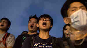 Pro-democracy protesters shout slogans during a standoff with police outside the central government offices in the Admiralty district of Hong Kong on Wednesday.