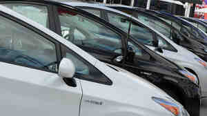 Sales of traditional hybrids, plug-ins and all-electric cars are down about 5 percent in 2014 — while truck and SUV sales have jumped.