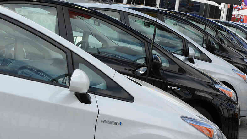 Sales of traditional hybrids, plug-ins and all-electric cars are down about 5 percent in 2014 — while truck and SUV sales have jumped.