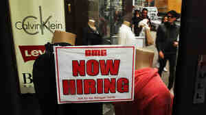 A notice in a store window in New York City announces a retail job opening. Now that unemployment has slipped below 6 percent, there's renewed interest in what the Federal Reserve's target for joblessness should be.