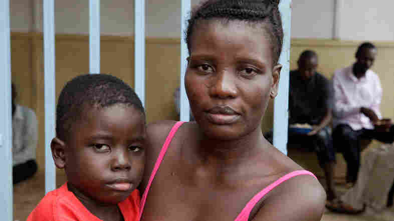 Jusoisatu Jusu and her son, Sam, are among the 30-some survivors living in the old Lassa Fever ward at Kenema Hospital.