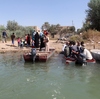 Citizens of Dhuluiyah, Iraq, must take boats to get in an out, since one of the town's two bridges was blown up by the Islamic State and the other was commandeered by tribesmen defending them. Citizens of Dhuluiyah, Iraq, must take boats to get in an out, since one of the town's two bridges was blown up by the Islamic State and the other was commandeered by tribesmen defending them.