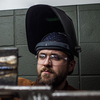 John Harris makes a weld for a test during a welding class at Spartanburg Community College in Spartanburg, S.C., on Oct. 22.