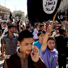 Demonstrators chant in favor of the Islamic State and carry the group's flags in Mosul, Iraq, in June. With videos, Internet magazines and social media, the group has effectively recruited throughout the world.