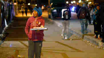 Abigail, 11, sells pastries on a street in El Alto, Bolivia, in June. Under the new law, 10-year-olds can work as long as they have parental consent and also attend school.