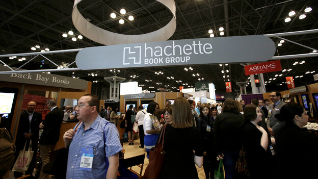 Visitors walk through the Hachette Book Group's exhibition in May at BookExpo America, the annual industry convention in New York. Visitors walk through the Hachette Book Group's exhibition in May at BookExpo America, the annual industry convention in New York.