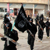 Islamic State fighters march in Raqqa, Syria. The group has killed five Western hostages in recent months. In the 1990s, many radical Islamist groups gave interviews to journalists and refrained from kidnapping Westerners.