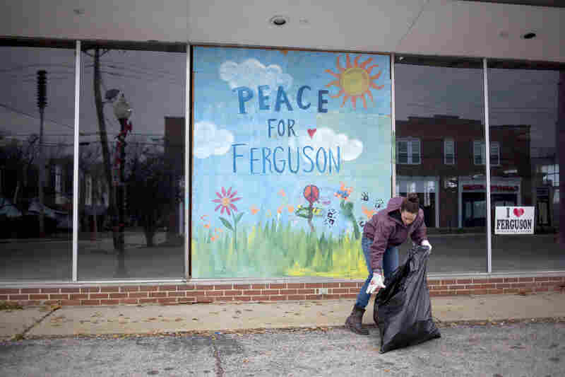 Jodi Wurm helps to clean up after violent protests damaged businesses in Ferguson. 