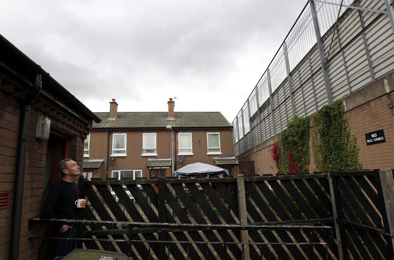 Retiree William Boyd looks at the peace wall that runs along the bottom of his garden in east Belfast, in 2012. Retiree William Boyd looks at the peace wall that runs along the bottom of his garden in east Belfast, in 2012.