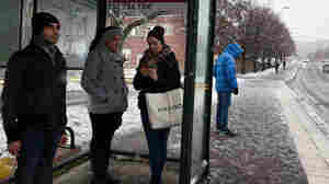 Residents wait at the bus stop in the Ronna neighborhood, where Syrian and Iraqi refugees are concentrated in Södertalje, Sweden. The Swedish city is known for its open-door policy toward refugees, especially Christian Syrians and Iraqis. People of Middle Eastern origin make up 30,000 of the town's 90,000 residents.