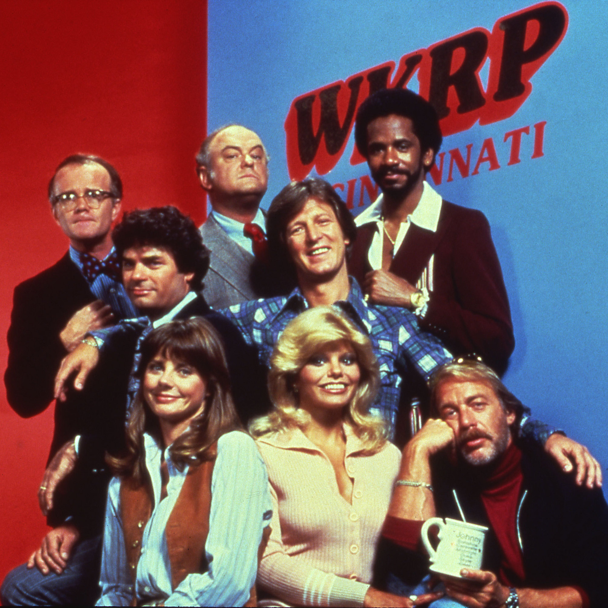 The cast of WKRP in Cincinnati, recently reissued on DVD by Shout! Factory, which collected licenses to include most of the original music broadcast on the show.