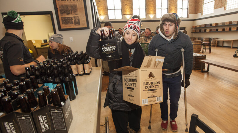 A craft beer fan picks up a six-pack of Goose Island Beer Co.'s limited Black Friday release of Bourbon County Brand Stout on Nov. 26 in Chicago. A craft beer fan picks up a six-pack of Goose Island Beer Co.'s limited Black Friday release of Bourbon County Brand Stout on Nov. 26 in Chicago.