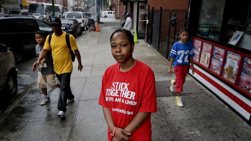 Shantel Walker stands outside a fast food restaurant June 19 in Brooklyn, New York. Walker, who made $8.25 per hour at a Brooklyn pizzeria, was part of a broad campaign by fast food workers to advocate for higher minimum wages. Shantel Walker stands outside a fast food restaurant June 19 in Brooklyn, New York. Walker, who made $8.25 per hour at a Brooklyn pizzeria, was part of a broad campaign by fast food workers to advocate for higher minimum wages.