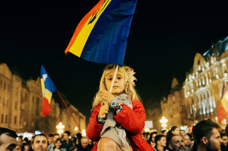 A young girl waves the Romanian flage at a recent anti-corruption rally in Timisoara, Romania.