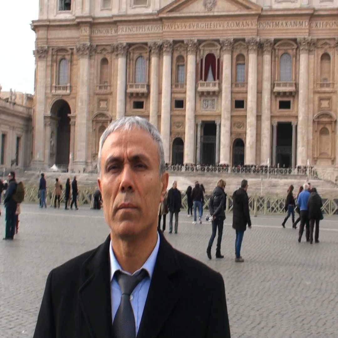 In this image taken from a video provided by Adnkronos International, Ali Agca stands in front of St. Peter's Basilica at the Vatican, on Saturday. Agca, who tried to assassinate Pope John Paul II in 1981, laid flowers at the late pontiff's tomb.