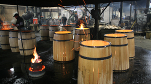 "Once we have the toast layer we'll let the barrel ignite," says Paul McLaughlin of Kelvin Cooperage in Louisville, Ky.