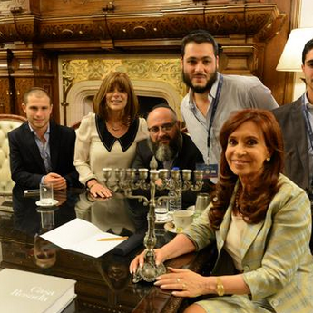 Argentine President Cristina Fernandez de Kirchner is seen with members of the Tawil family on Dec. 23. Kirchner embraced their seventh son, Yair, as her godson in line with an Argentine tradition that offers presidential protection to the seventh son in a family with only male children to prevent him from turning into a werewolf.