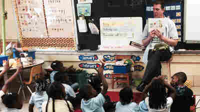 Thomas O'Donnell reads about Twiggle the Turtle to his kindergartners at Matthew Henson Elementary School in Baltimore.