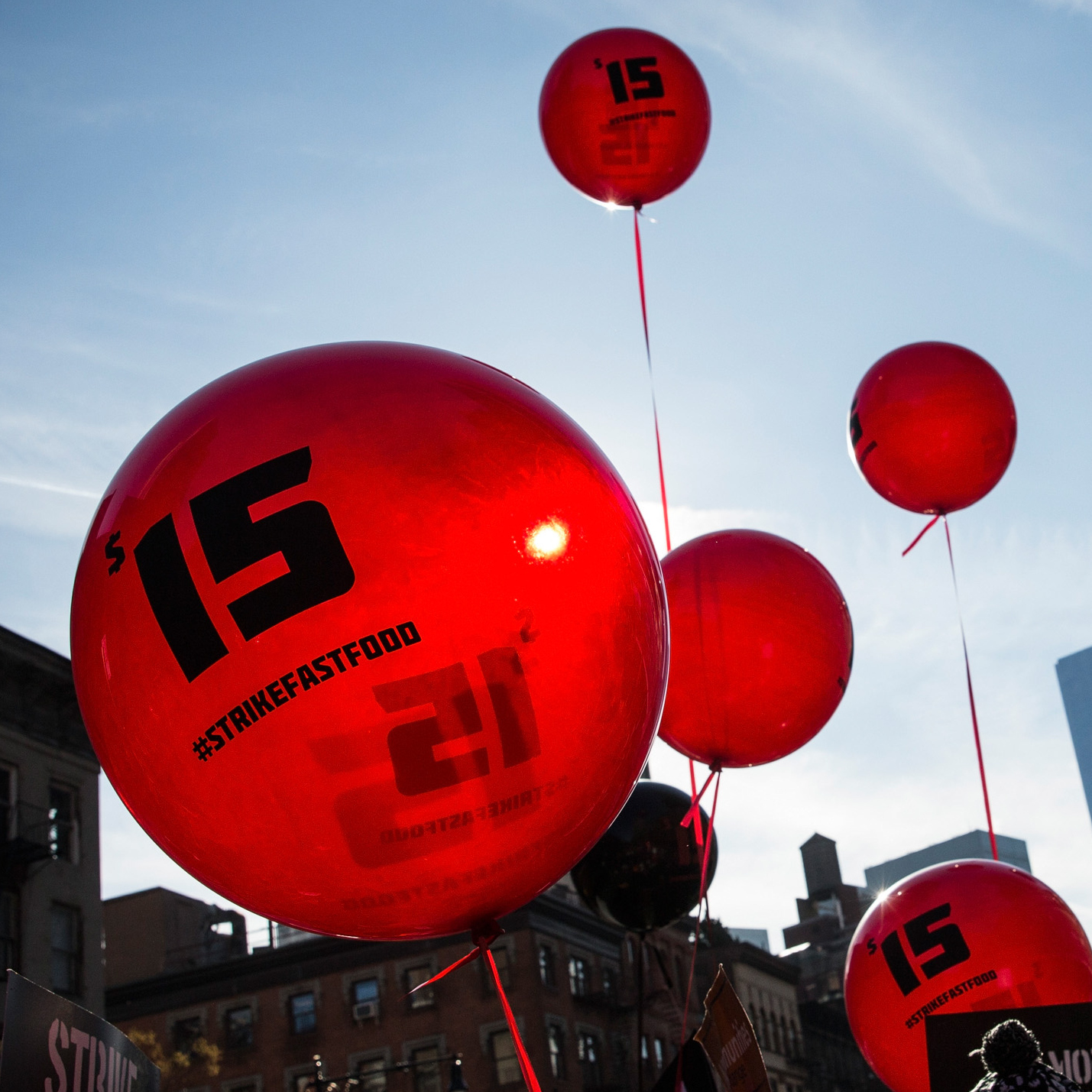 Protesters march in New York City on Dec. 4 to demand an increase in the minimum wage to $15 per hour. New York state's minimum wage rose to $8.75 on Wednesday.