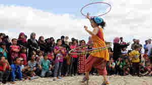 Lebanese clown Sabine Choucair, a member of "Clowns Without Borders," performs for children in June at a Syrian refugee camp in the eastern town of Chtoura, Lebanon.