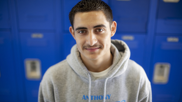 Junior Adriano at his former high school in Anthony, Texas. (NPR)