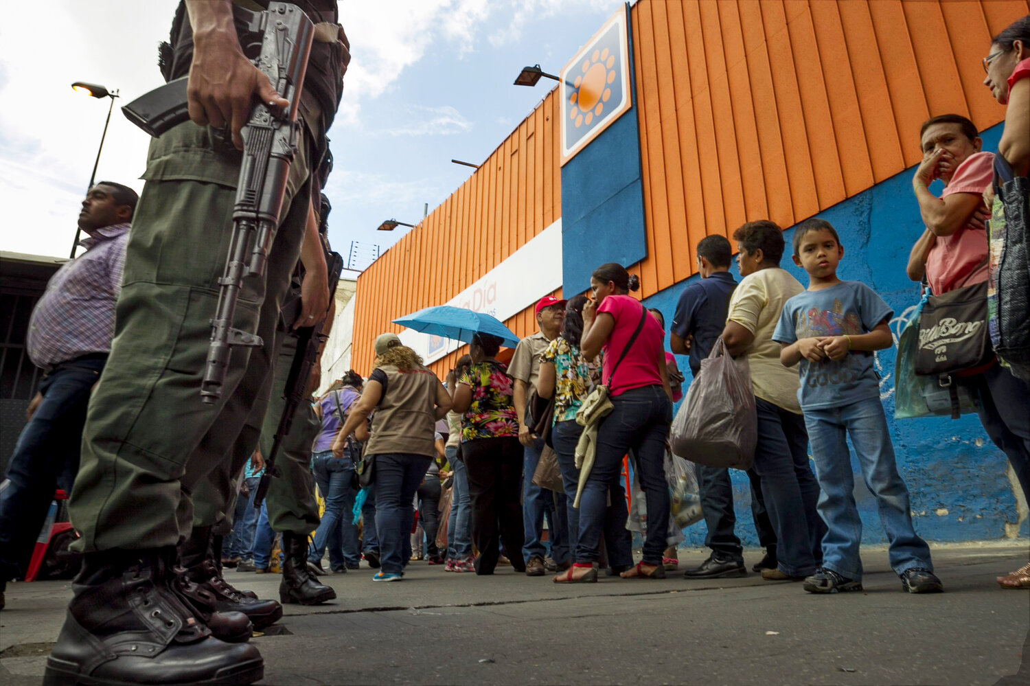 Shoppers queue outside the supermarket 'Dia a Dia' in Caracas, Venezuela, on Tuesday. The government took over stores of supermarket chain after alleging that it was hoarding food. According to many economists, government controls are making the economic crisis worse. Shoppers queue outside the supermarket 'Dia a Dia' in Caracas, Venezuela, on Tuesday. The government took over stores of supermarket chain after alleging that it was hoarding food. According to many economists, government controls are making the economic crisis worse.