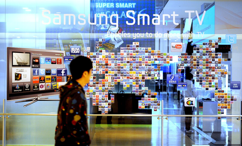 A man walks past a Samsung smart TV advertisement at a showroom in Seoul in 2011. A man walks past a Samsung smart TV advertisement at a showroom in Seoul in 2011.