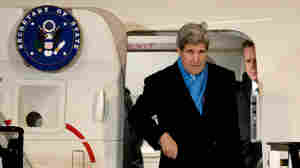 Secretary of State John Kerry arrives at the airport in Munich, Germany, on Feb. 5. On the way back to the U.S., Kerry's plane stopped in Boston during a snowstorm so he could see his new grandchild. Such personal stops are permitted, though they sometimes raise eyebrows.