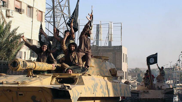 Fighters from the self-declared Islamic State parade through Raqqa, Syria, in June 2014. (AP)