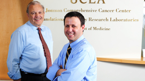 Dr. Richard Finn (right) at the UCLA Geffen School of Medicine and his colleague Dr. Dennis Slamon at the Revlon/UCLA Women's Cancer Research Program.