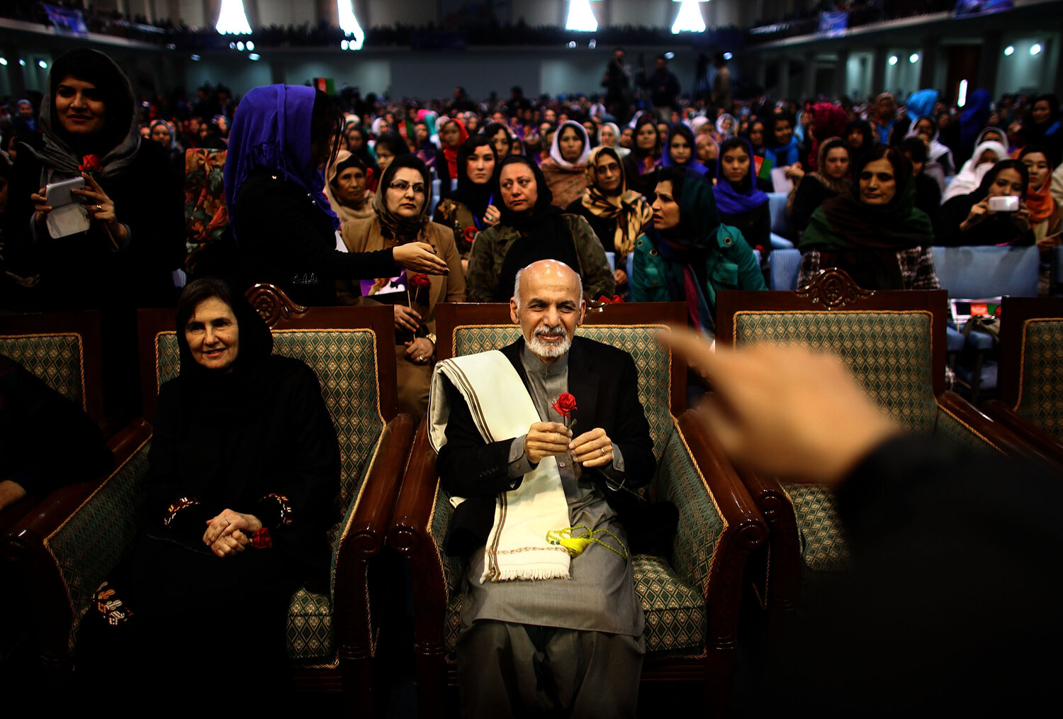 Then-presidential candidate Ashraf Ghani sits next to his wife, Rula, during a campaign rally in Kabul on March 9, 2014. In an unusual move for Afghan politics, Ghani's wife spoke during the rally — a foreshadowing of her role in her husband's presidency. Then-presidential candidate Ashraf Ghani sits next to his wife, Rula, during a campaign rally in Kabul on March 9, 2014. In an unusual move for Afghan politics, Ghani's wife spoke during the rally — a foreshadowing of her role in her husband's presidency.