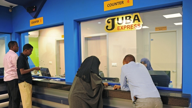Customers wait to collect money at the Juba Express money transfer company in Mogadishu, Somalia, on Feb. 12. (AFP/Getty Images)