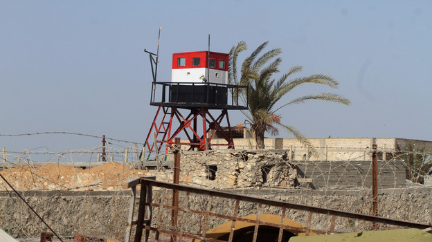 Members of Palestinian security forces loyal to Hamas patrol on the border between Egypt and southern Gaza Strip earlier this month. (APA/Landov)