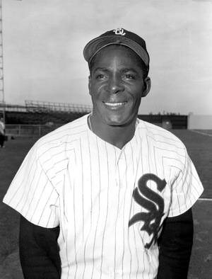 Chicago White Sox outfielder Orestes "Minnie" Minoso smiles in Tampa, Fla., on March 9, 1957. Minoso, who was born near Havana, Cuba, became the first black player with the White Sox when he was traded in 1951 by the Cleveland Indians.