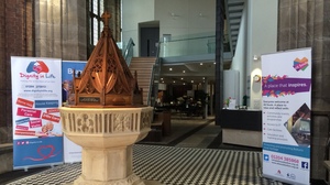 Beyond the entrance to All Souls Church in Bolton, England, are a small cafe, the original altar and pipe organ, gathering spaces for the community, and a touch-screen terminal that plays recorded recollections of the church's history.