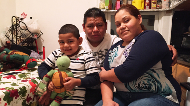 Wilfredis Ayala, an unauthorized immigrant from El Salvador, lives in Long Island, N.Y., with his U.S.-born son Justin and Justin's mother Wendy Urbina. (NPR)