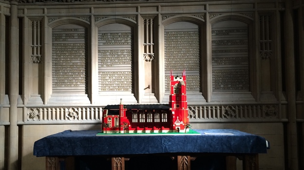 A Lego model of All Souls Church rests on the altar, which was retained when the Bolton, England, church was renovated into an interfaith community center. The model was built by children taking part in an after-school program there. (NPR)
