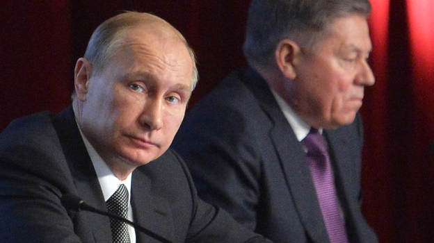 Russian President Vladimir Putin (left) attends an Interior Ministry meeting Wednesday in Moscow. He condemned the death of Boris Nemtsov, saying it was a "disgrace" to Russia. (AP)