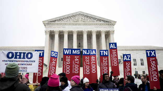Fans and foes of Obamacare jockeyed for position outside the Supreme Court Wednesday. Inside, the justices weighed arguments in the case of King v. Burwell, which challenges a key part of the federal health law. (UPI/Landov)