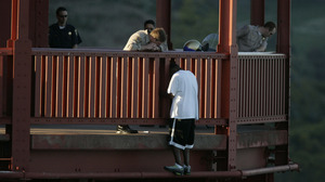 Kevin Berthia is talked down by California Highway Patrol Kevin Briggs at the north tower of the Golden Gate Bridge in 2005.