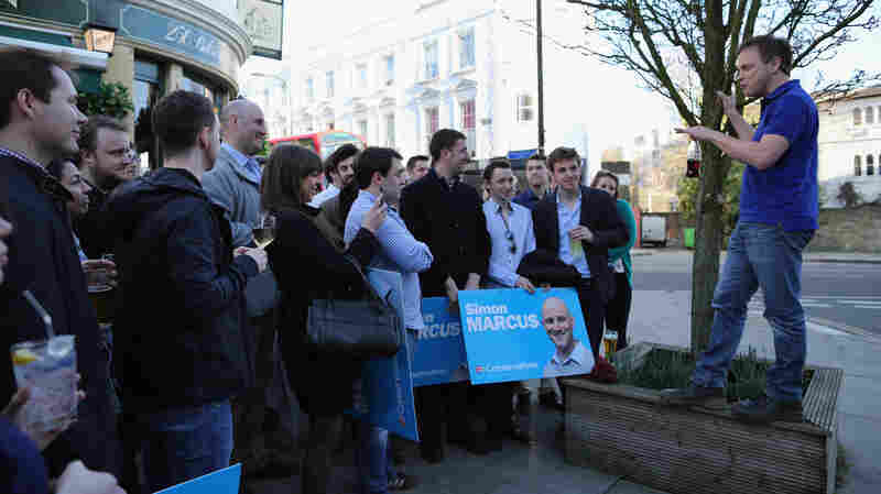 Conservative party Chairman Grant Shapps speaks to party supporters after canvassing in London on Saturday.