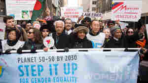 U.N. Secretary-General Ban Ki-Moon (in white-and-blue vest) joins other leaders at the 2015 International Women's Day March at Dag Hammarskjold Plaza on March 8 in New York City.